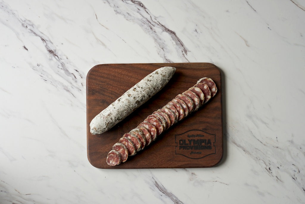 Open package salami whole and sliced.
