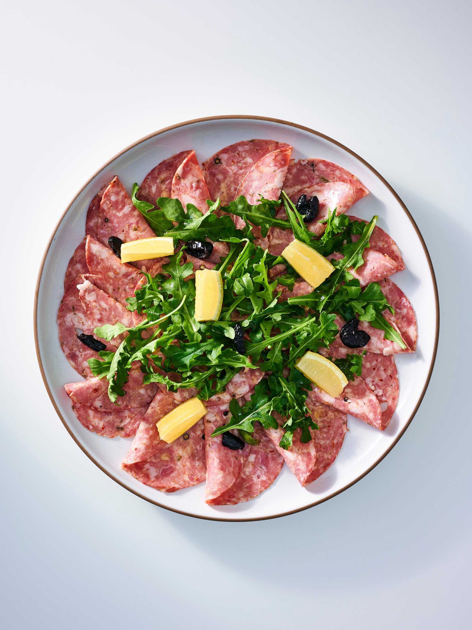 sliced salami cotto with salad