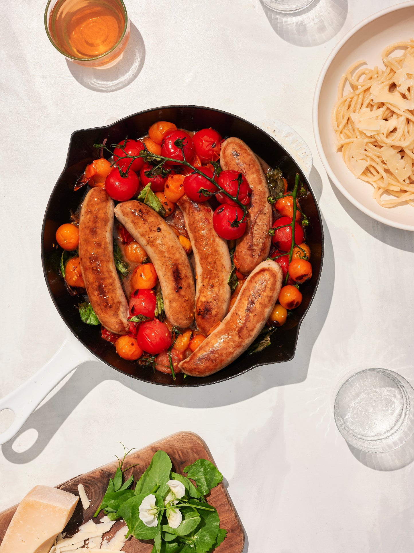 italian sausge with tomatoes in pan