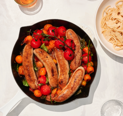 sausage in pan with tomatoes